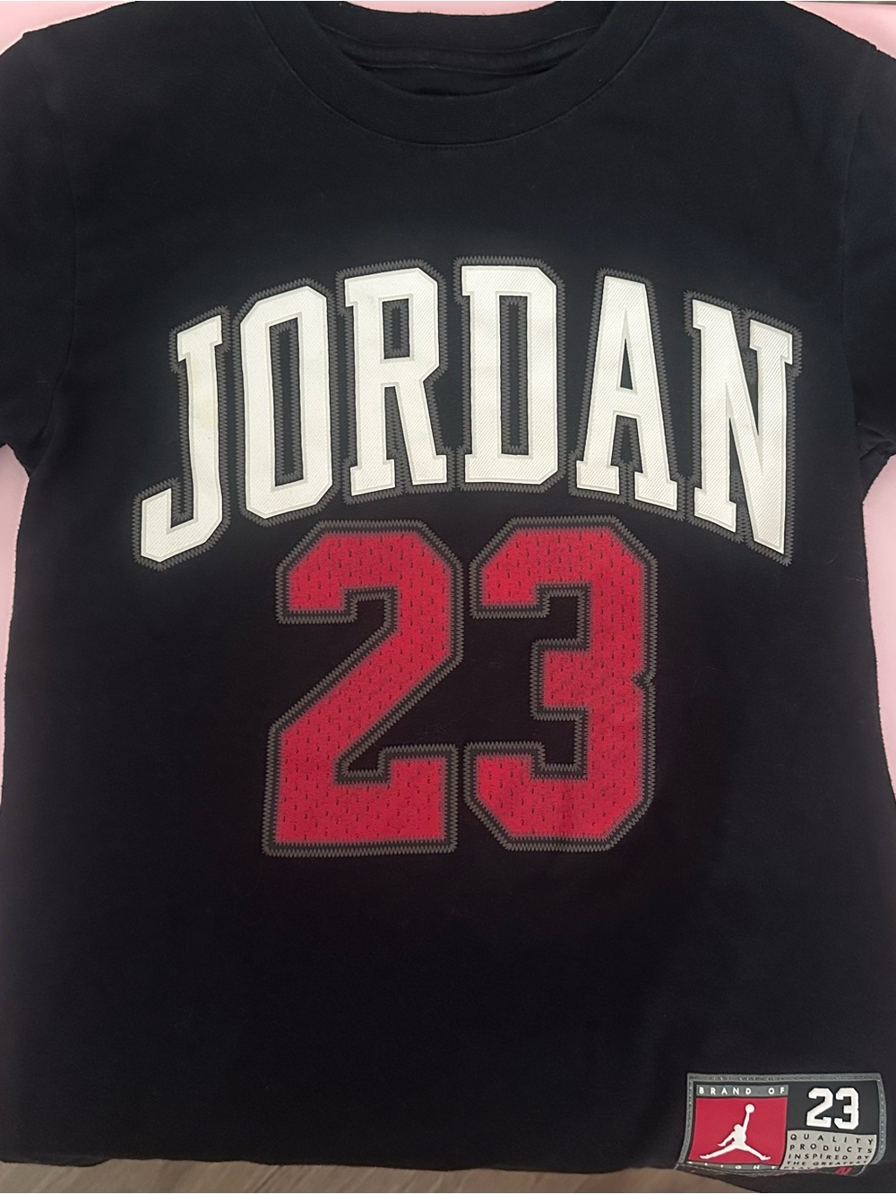 Jordan Black Tee with White 'JORDAN' and Red 23 Graphic